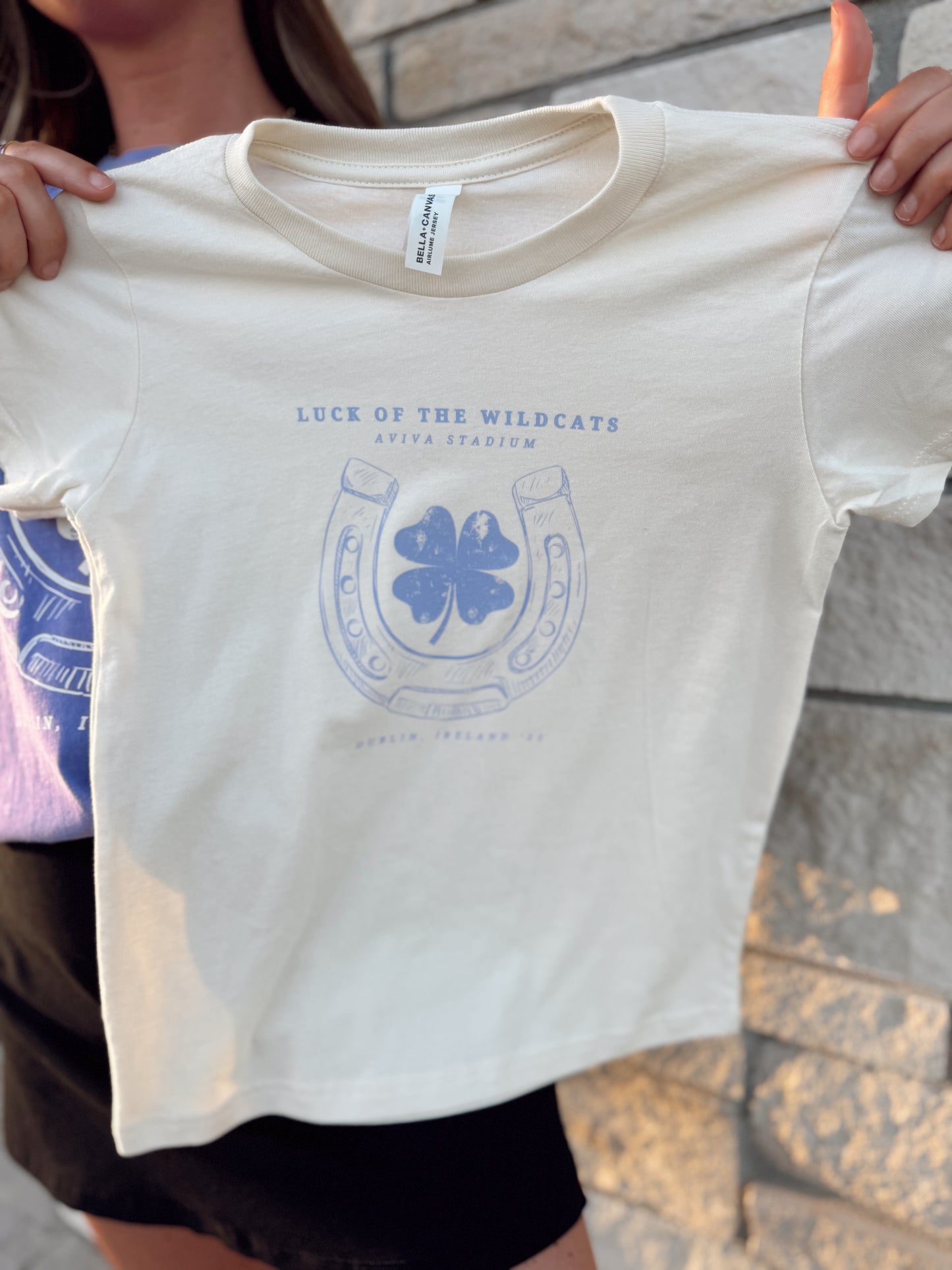 LUCK OF THE WILDCATS NATURAL— INFANT ONESIE + TODDLER/YOUTH TEE